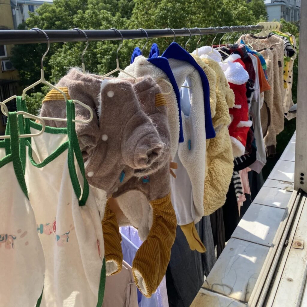 A collection of dog clothing drying